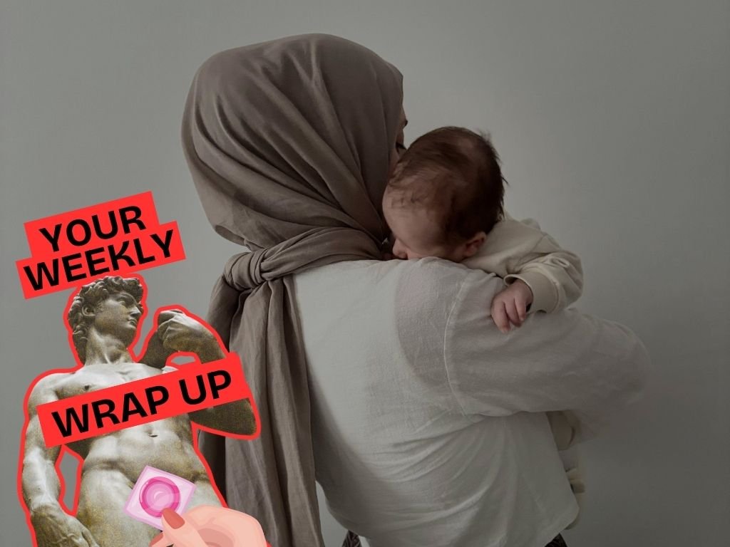 A person wearing a headscarf holds a sleeping baby against their shoulder, facing away from the camera, in a softly lit, neutral setting. Overlaid on the left is a graphic reading “Your Weekly Wrap Up,” alongside an edited image of a classical statue with a bright red outline and a pink censor sticker over the genitals.