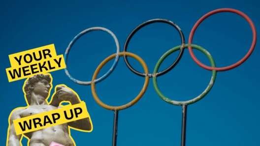 Olympic rings against a blue sky with a graphic reading “Your Weekly Wrap Up” over a classical statue illustration with a censored sticker.