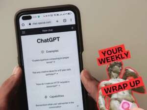 A person holds a smartphone displaying the ChatGPT homepage, with example prompts visible on the screen. To the right, a graphic overlay reads “Your Weekly Wrap Up” in bold red text, alongside an image of a classical statue (Michelangelo’s David) partially covered with a pink condom over the genitals.