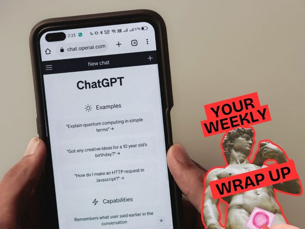 A person holds a smartphone displaying the ChatGPT homepage, with example prompts visible on the screen. To the right, a graphic overlay reads “Your Weekly Wrap Up” in bold red text, alongside an image of a classical statue (Michelangelo’s David) partially covered with a pink condom over the genitals.