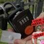 Close-up of a hand holding a blister pack with a single pill next to a black combination padlock attached to a metal fence outdoors. Overlaid graphic reads “Your Weekly Wrap Up” in bold red text, alongside a stylised image of a classical statue partially covered with a pink sticker.