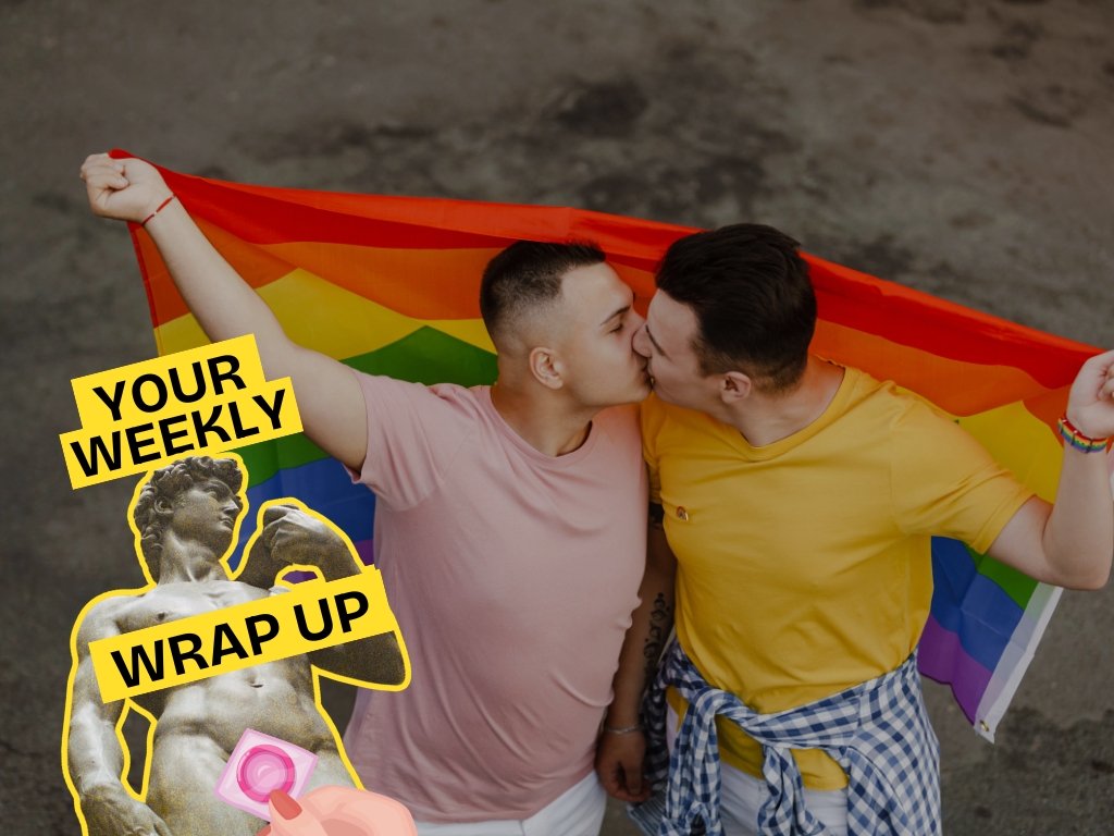 Two men kiss while holding a rainbow Pride flag behind them. A “Your Weekly Wrap Up” graphic featuring a classical statue and a condom illustration appears in the bottom left corner.