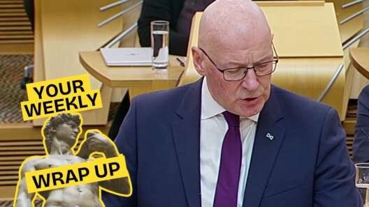 A bald man in glasses and a dark suit speaks in the Scottish Parliament chamber. A “Your Weekly Wrap Up” graphic with a classical statue and condom illustration appears in the lower-left corner.