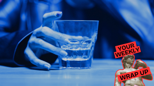 Close-up of a person holding a glass containing a clear drink under blue lighting. A “Your Weekly Wrap Up” graphic with a classical statue and condom illustration appears in the lower-right corner.