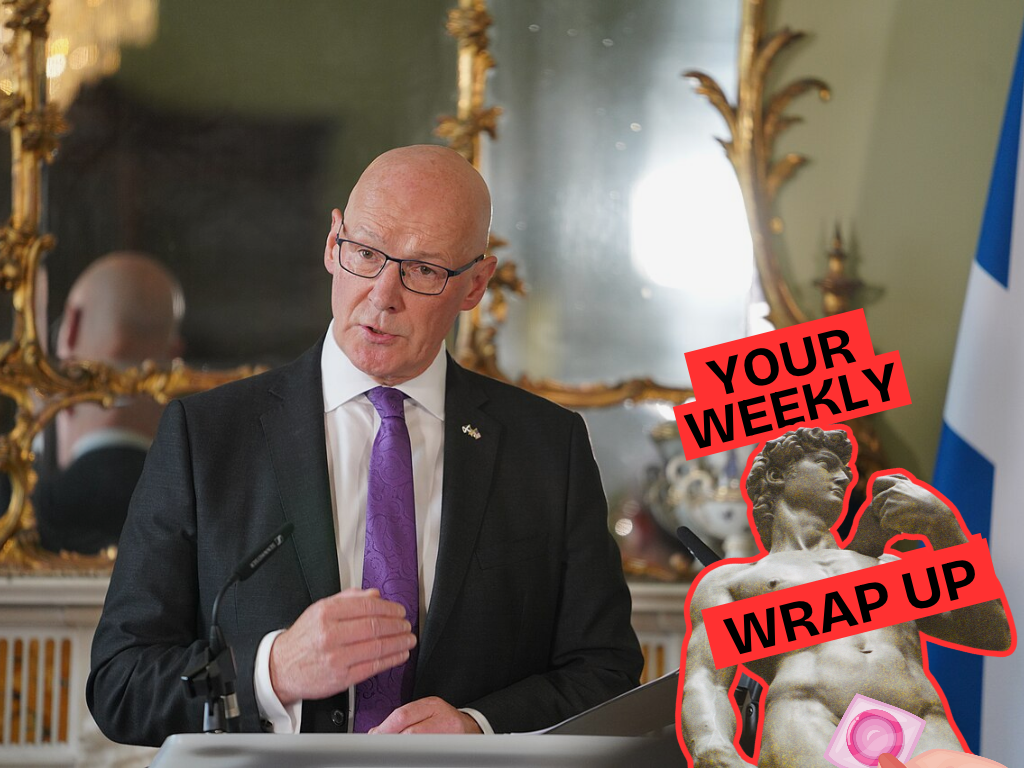 A bald man in glasses, a dark suit and purple tie speaks at a lectern beside a Scottish flag, with an ornate mirror behind him. A “Your Weekly Wrap Up” graphic with a classical statue and condom illustration appears on the right.