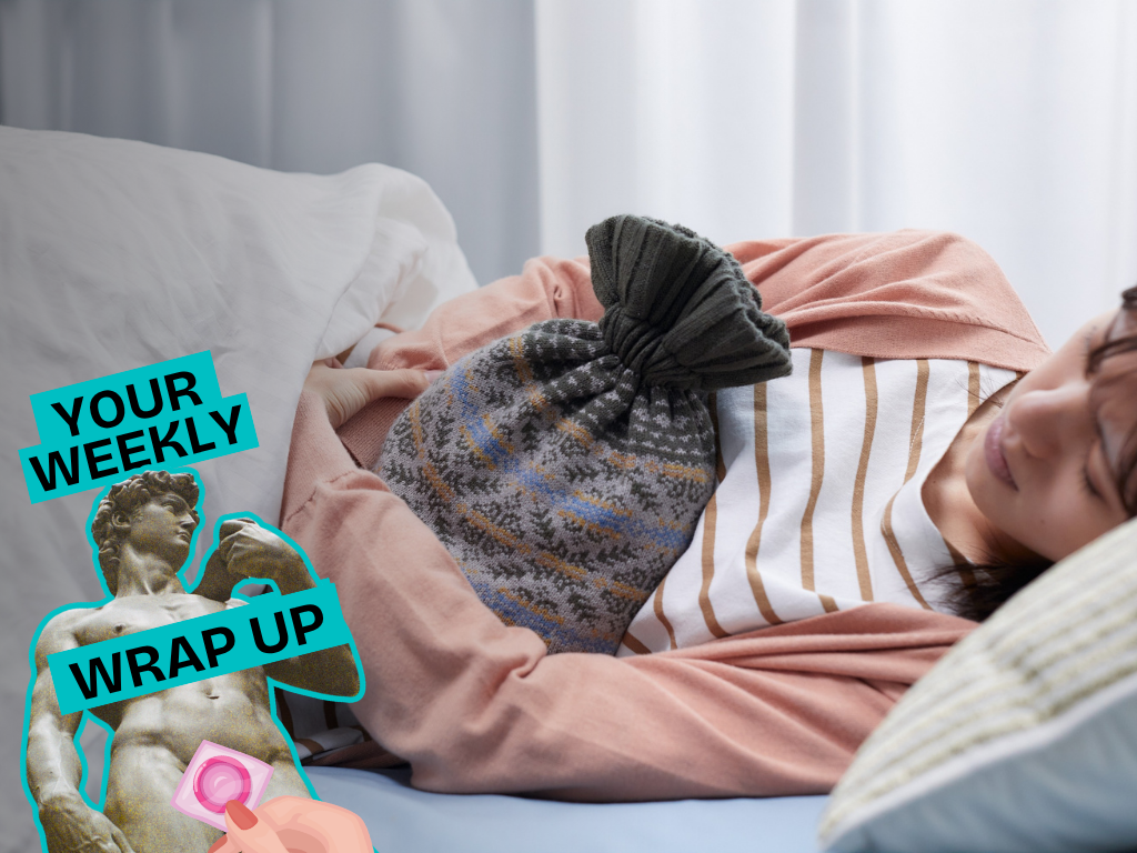 A person lies curled on their side in bed, holding a hot water bottle against their abdomen. A “Your Weekly Wrap Up” graphic with a classical statue and condom illustration appears in the lower-left corner.